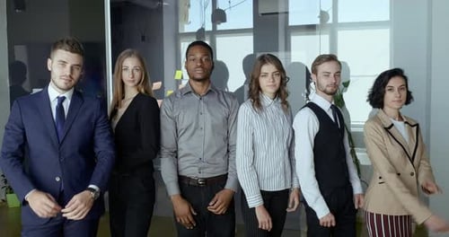 Serious Multiethnic Business Group Posing with Arms Crossed Showing Team Support, Strength. Office