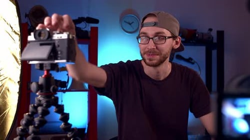 Man Vlogging About Technology in Home Studio