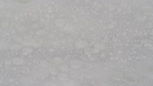 Water Drops on White Cloth Closeup