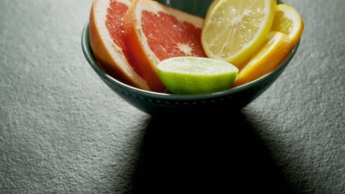 Close up of Sliced Citrus Fruit in Bowl