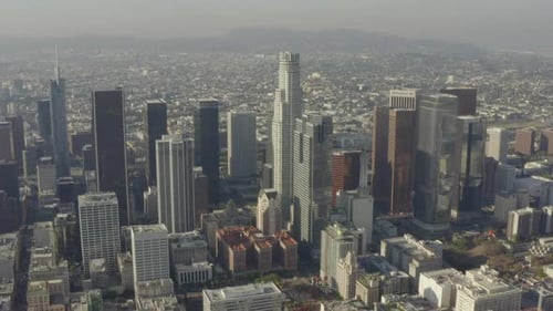 AERIAL: Breathtaking Wide Shot of Downtown Los Angeles, California Skyline in Beautiful Sunlight
