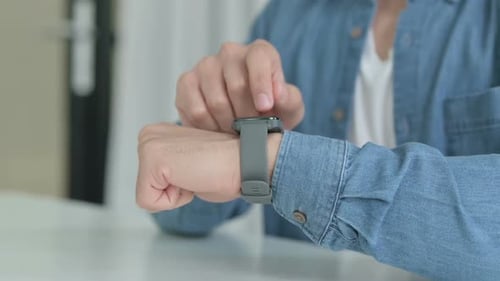 Person Using Smart Watch Technology Device