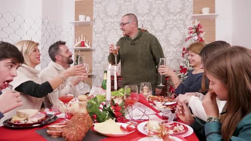 Family Celebrates Christmas with a Festive Dinner
