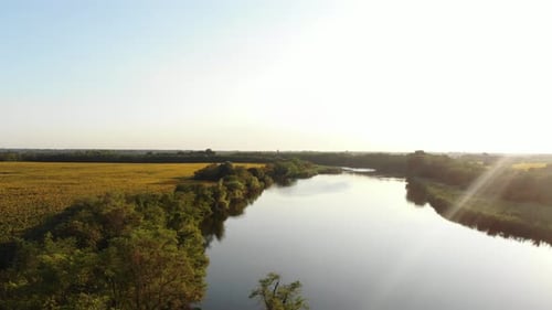 View of the river and meadow in the sun.