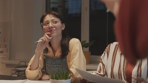 Marketing Specialists Having Office Meeting in Evening