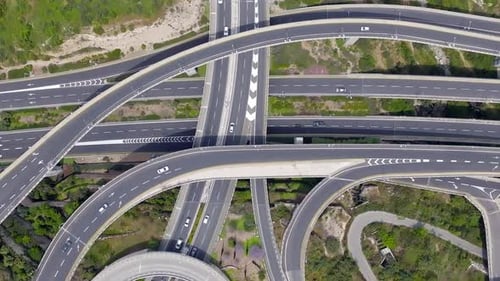 Massive multi level highway interchange with traffic on all routes, Aerial view.