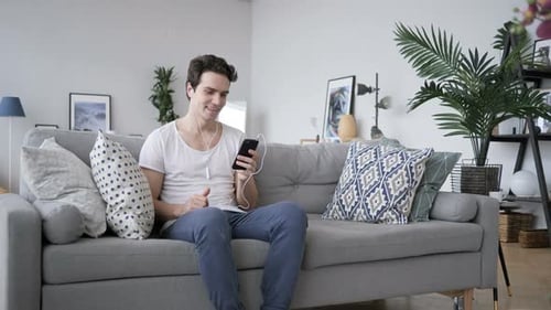Young Adult on Video Call on Smartphone