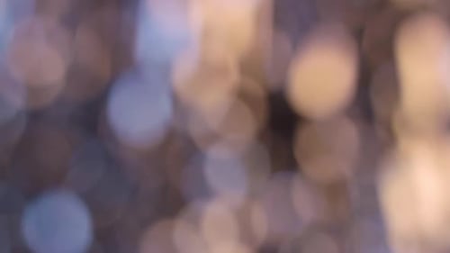 Goldene verschwommene abstrakte funkelnde Lichter. Bokeh-Hintergrund