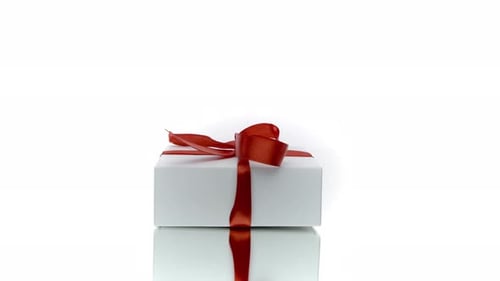 Elegant White Gift Boxes Stacked with Red Bows
