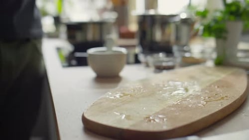 Adding Fresh Parsley to a Wooden Cutting Board
