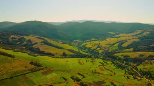 Aerial View of Green Valley and Mountains