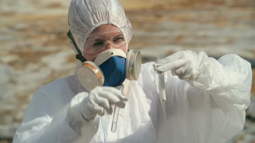 Scientist in Protective Suit Conducts Experiment