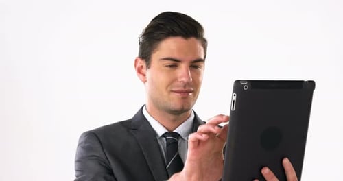 Person in Suit Using Tablet Close Up