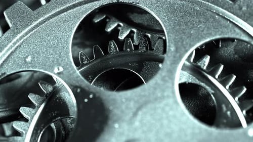 Interlocking Metal Gears Rotating Close Up