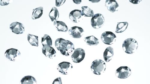 Shining Diamonds Falling on White Background