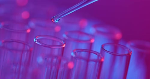 Liquid Being Dropped Into a Test Tube