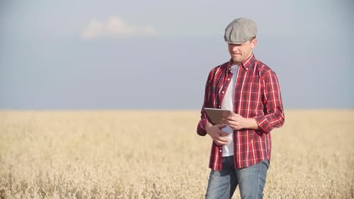 Farmer in Field with Tablet