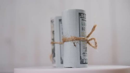 Rolls of United States Currency with Twine