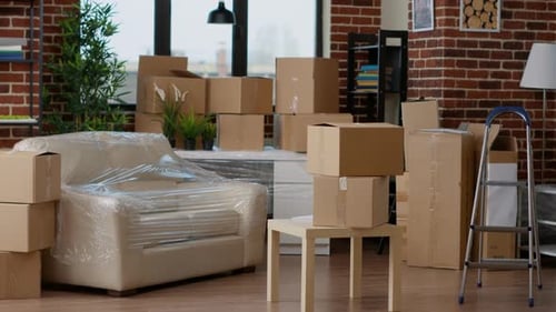 Boxes Stacked in a Home Interior During Daytime