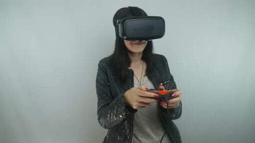 Woman Using Virtual Reality Headset and Controller