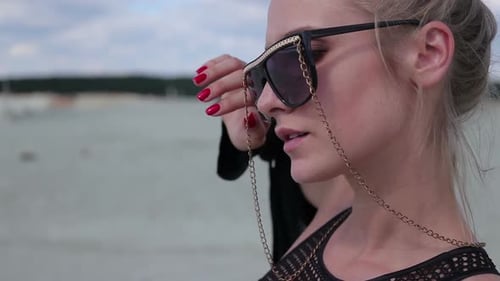Blonde Woman Posing in Swimwear on the Beach