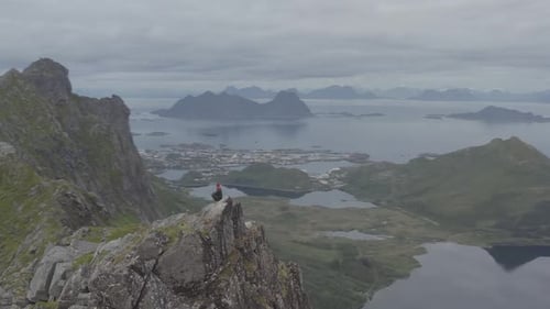 Man On Top Of A Mountain