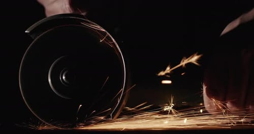 Angle Grinder Sparks in a Dark Setting