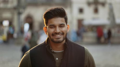 Indian Guy with Sincere Smile on Face Posing on City Street
