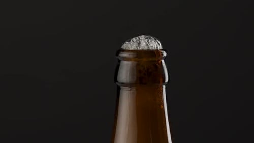 Close-up of Foamy Beer Bottle