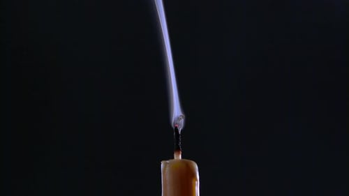 Candle Is on and Goes Out. Black Background. Close Up