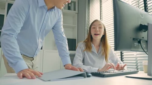 Asian businessman and Caucasian businesswoman people working in office.