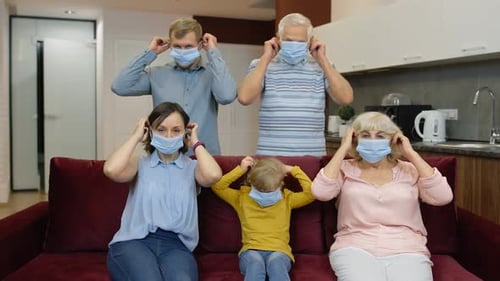 Family Putting on Blue Surgical Masks