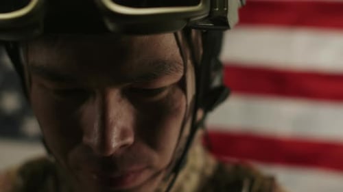 Man in Military Gear With American Flag