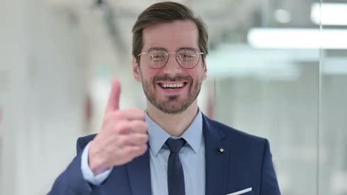 Man in Suit Gives Thumbs Up
