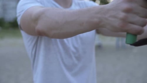 Man Exercising with Resistance Bands Outdoors