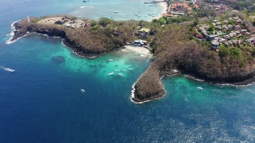 Sparkling Water By Coast in Bali Indonesia with Forest Trees Surrounding Island