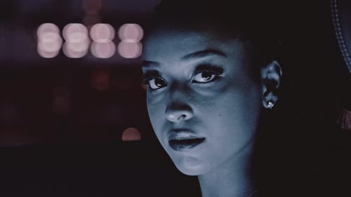 Young Woman Close-Up Gaze at Night