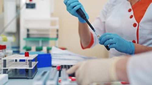 Lab Technicians Conduct Medical Research Experiment