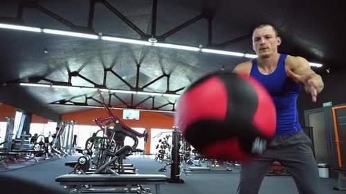 Fit Man Doing Medicine Ball Exercises