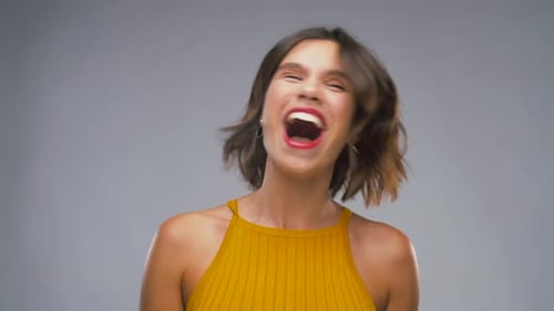 Happy Young Woman Shaking Head
