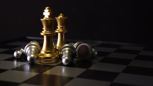 Gold King and Queen with Defeated Pawns