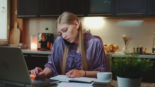 Woman Works From Home with Laptop and Phone