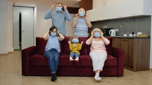 Family Wearing Face Masks at Home During Pandemic