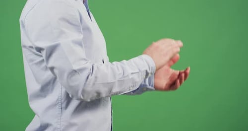 Side view of a man clapping