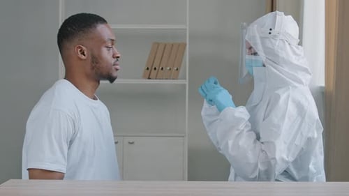 Afro American Male Sick Patient Comes to Hospital Table for Medical Analysis Female Doctor Nurse in
