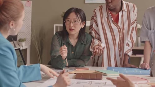 Female Team of Architects Discussing Project in Office