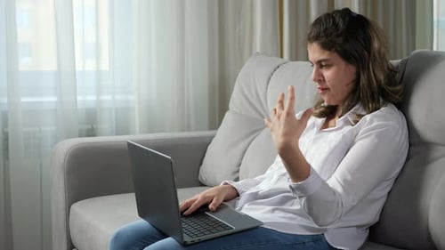Disabled Woman Talks at Job Interview Via Skype on Laptop