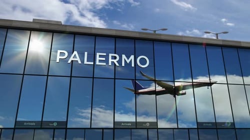 Airplane landing at Palermo Sicily Italy airport mirrored in terminal