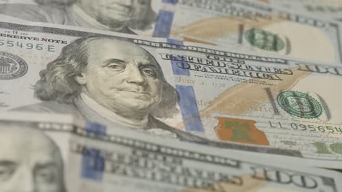 Dollar banknotes in a row close-up slow tilt 4K 2160p 30fps UltraHD footage - Paper USD currency