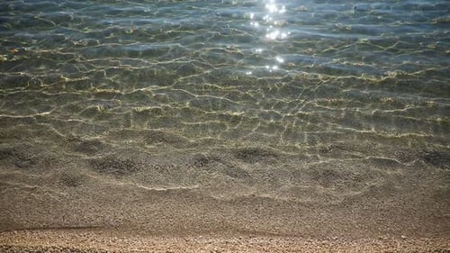 Ripples on Surface of Sand Sea Bottom Clear and Calm Blue Sea Water Fishes in Water Nature Texture